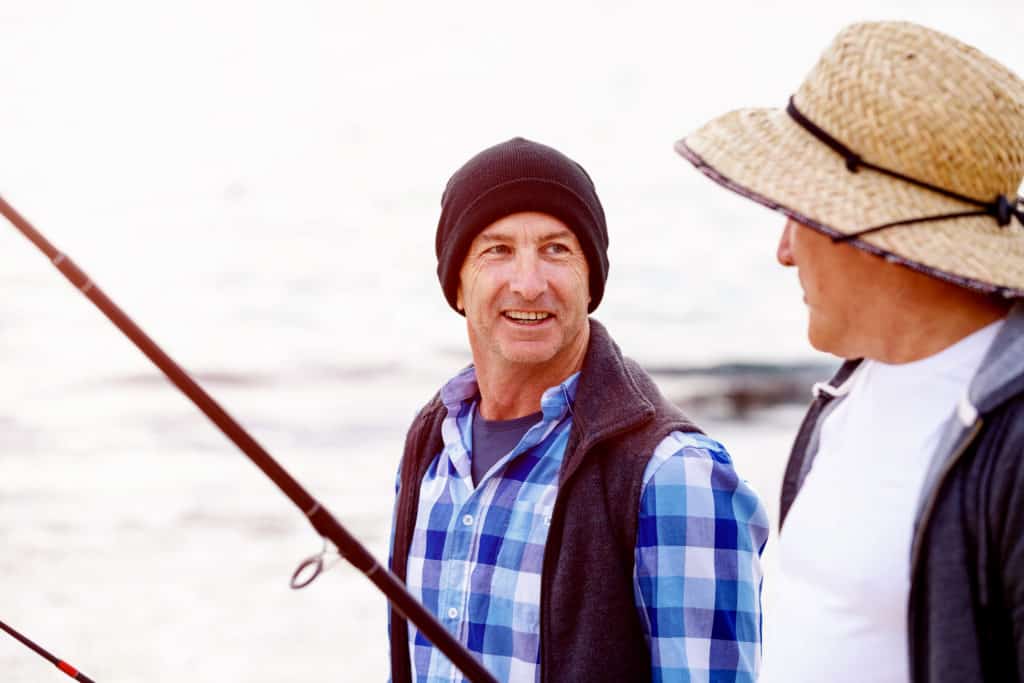 Picture of fishermen with different hats and head coverings