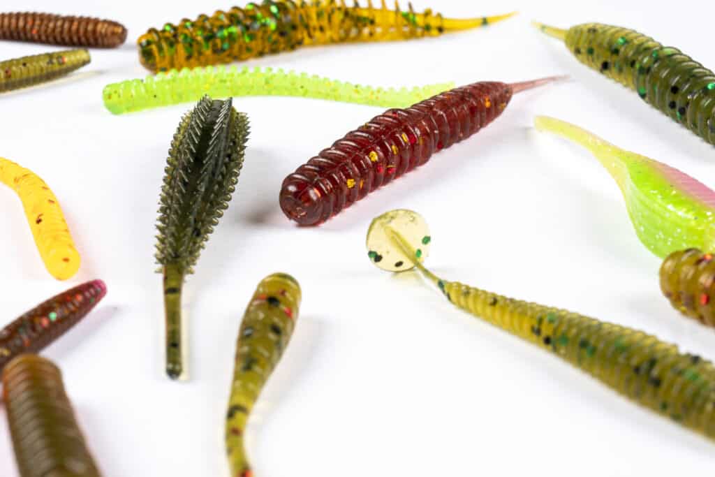 variety of crappie jigs on white background.