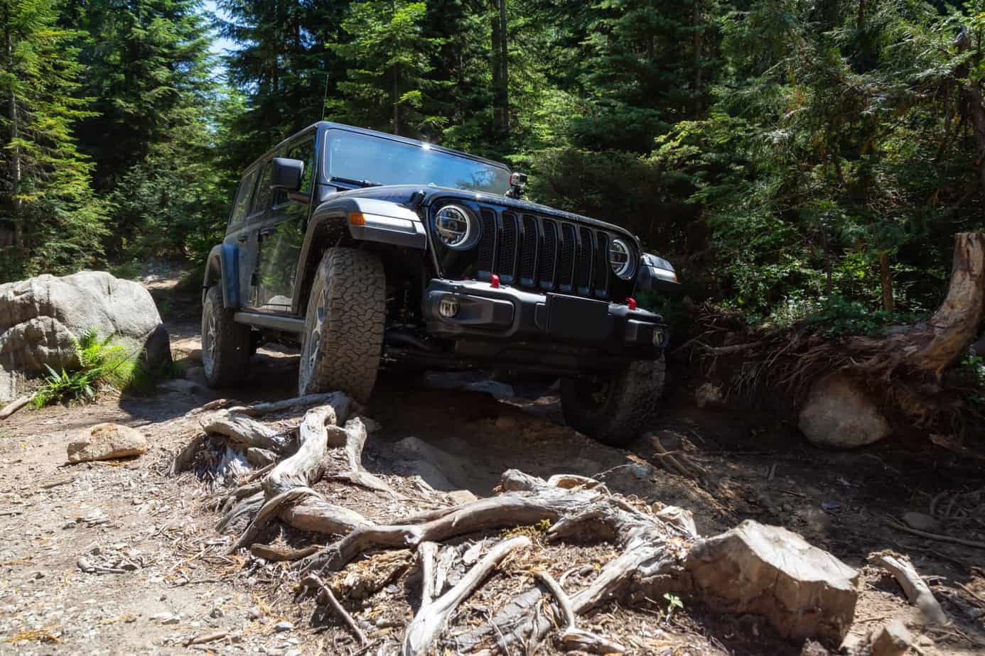 Mission, British Columbia, Canada - August 6, 2018: Jeep Rubicon is riding thru rough and rugged terrain to the lake.