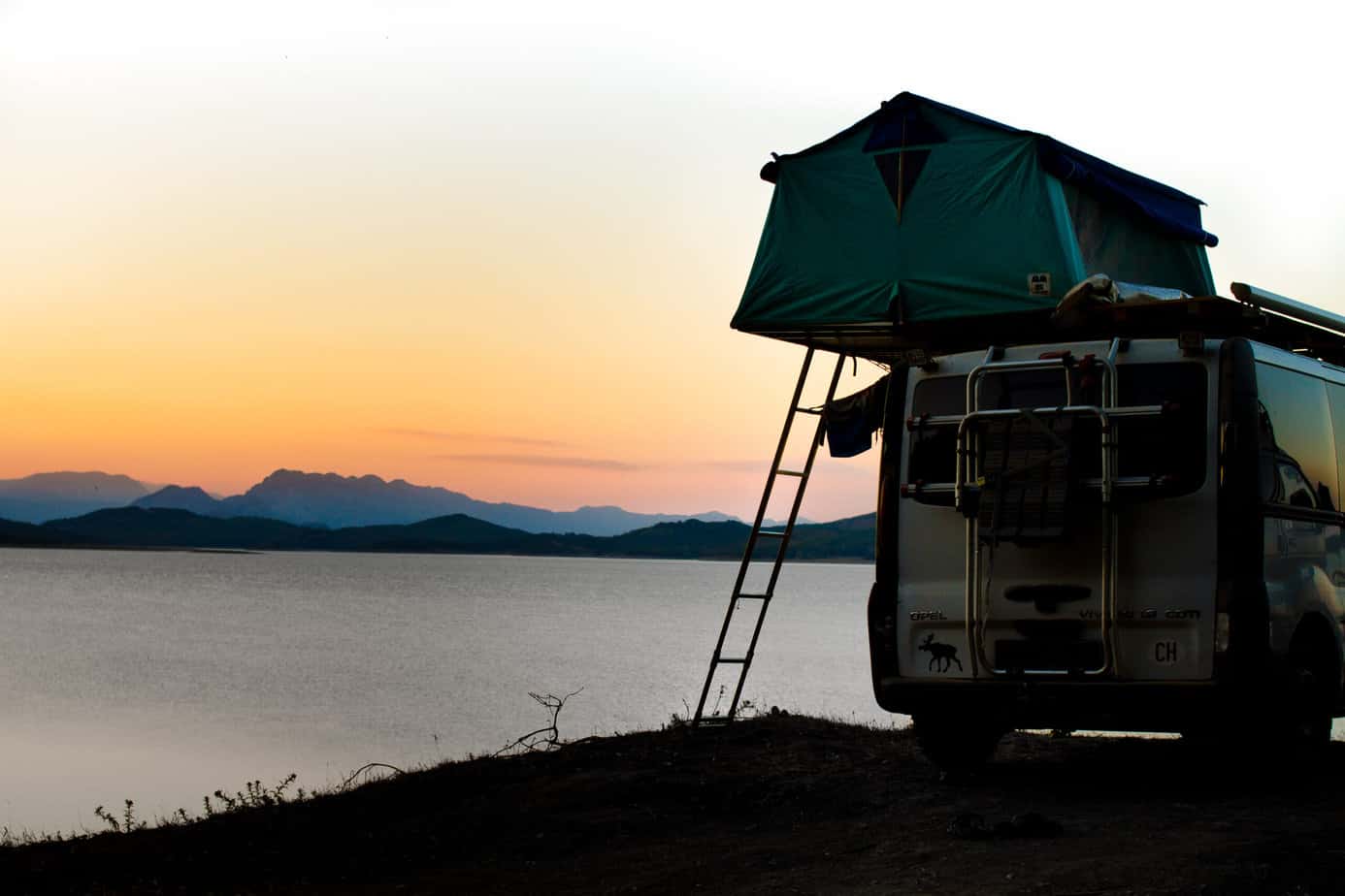 rooftop tent on a lake
