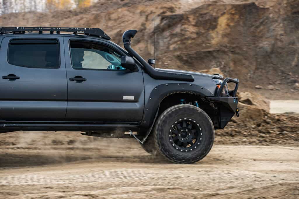 Black Toyota Tacoma quick ride on a offroad